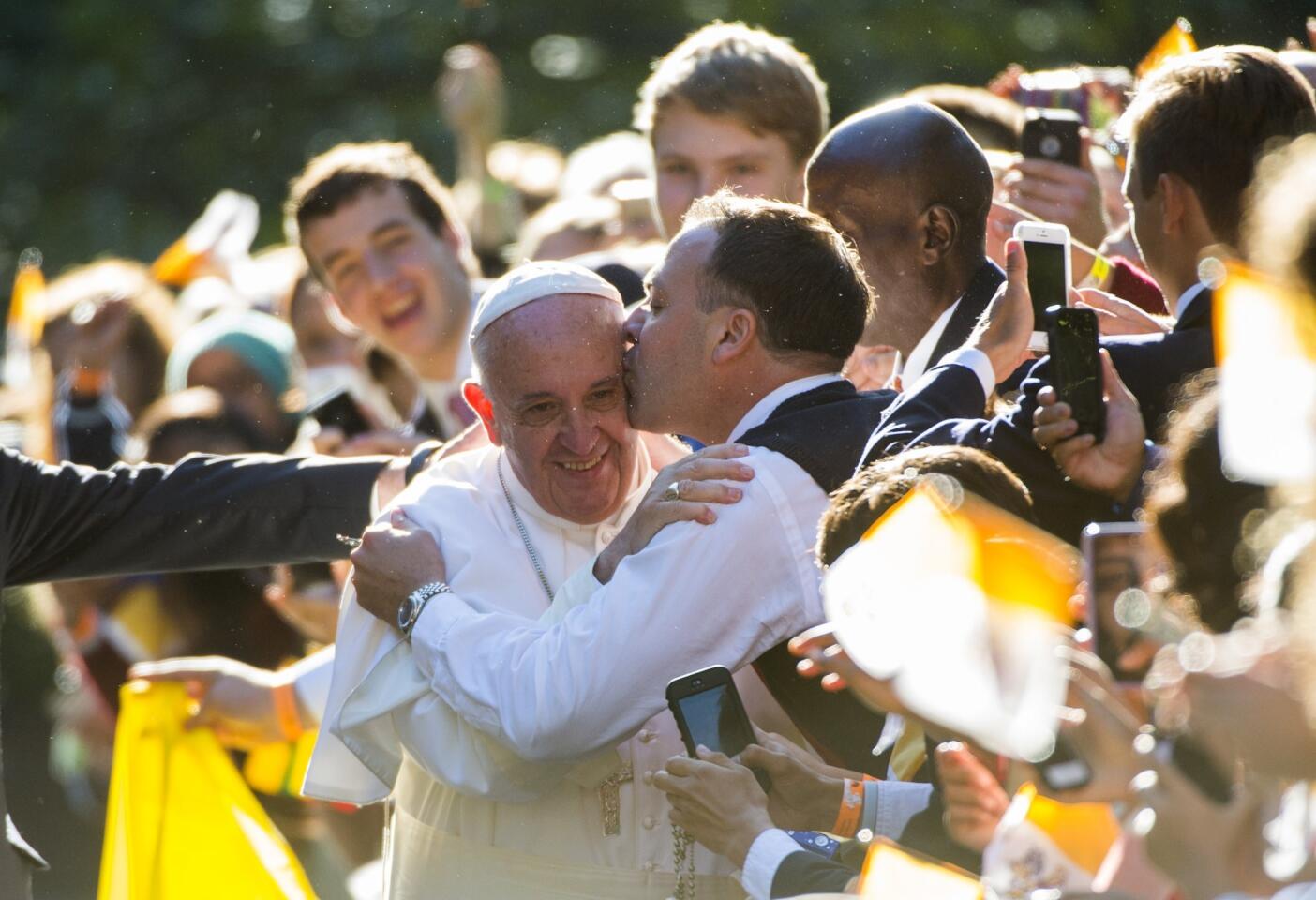 Pope Francis gets a kiss outside the Apostolic Nunciature to the United States in Washington on Sept. 23, 2015.