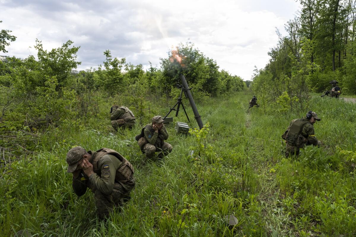 Ukrainian troops firing artillery