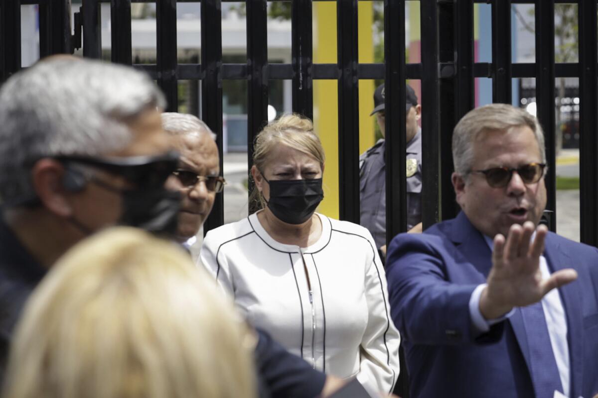 Puerto Rico's former Gov. Wanda Vazquez leaves a court after she was released on bail, in San Juan, Puerto Rico, Thursday, Aug. 4, 2022. Vazquez, who was arrested Thursday, is accused of engaging in a bribery scheme from December 2019 through June 2020, while she was governor, with several people, including a Venezuelan-Italian bank owner, a former FBI agent, a bank president and a political consultant. (AP Photo/Alejandro Granadillo)