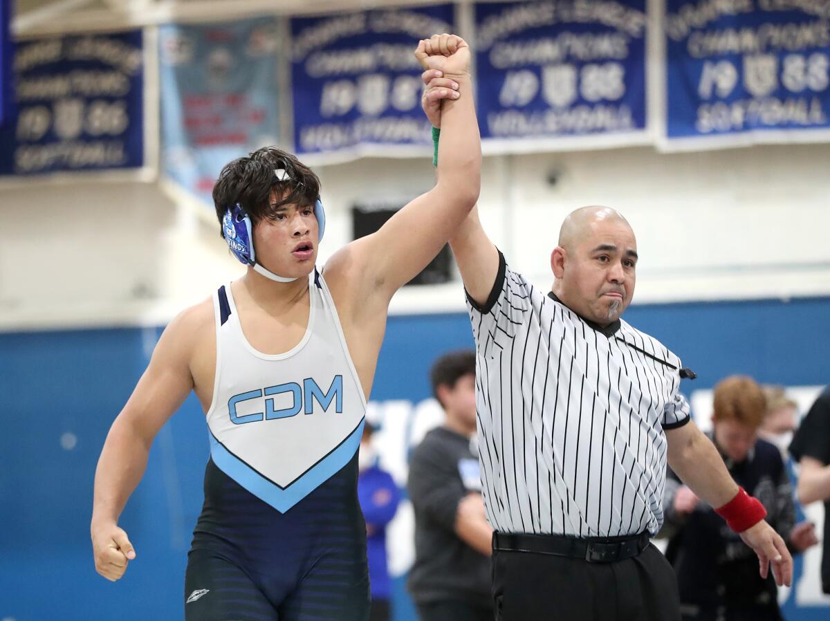 CdM's Eugenio Franco is declared the winner in the 195-pound match during the CIF Division 6 finals against Western.