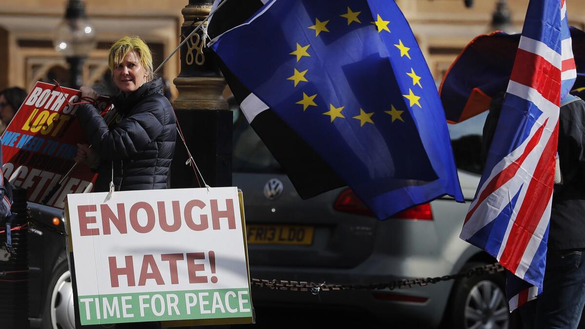 Brexit protesters demonstrate near the House of Parliament in London, March 26, 2019.