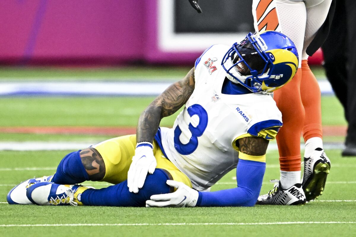 Rams wide receiver Odell Beckham Jr. grabs his injured knee during Super Bowl LVI.