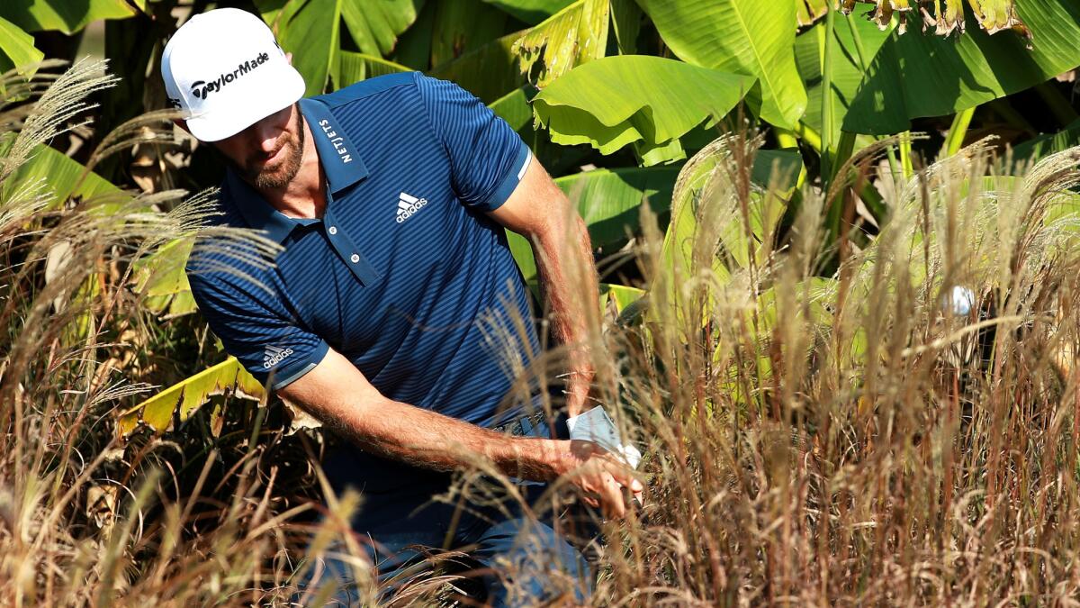 Dustin Johnson plays a shot out of the rough at No. 10 during the third round of the HSBC Champions tournament in Shanghai on Saturday.