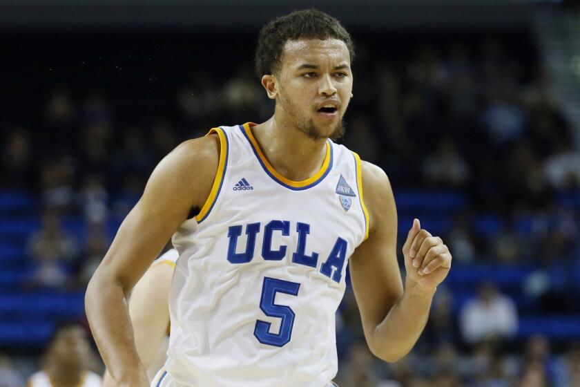 UCLA's Kyle Anderson celebrates after hitting a three-pointer at the first-half buzzer during the Bruins' 83-60 win over Weber State on Sunday.