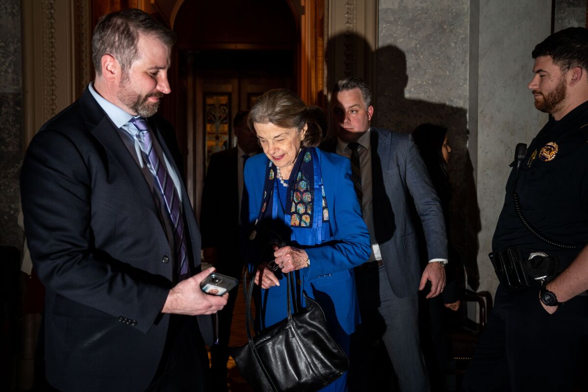 Dianne Feinstein leaves the Senate chamber.