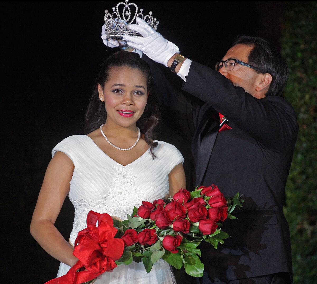 Rose Queen Madison Triplett is crowned by Tournament of Roses President Rich Chinen at the announcement and coronation ceremony for the 2015 Tournament of Roses on the front steps of the Pasadena Civic Auditorium on Tuesday, October 21, 2014.