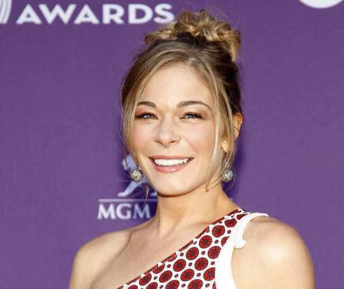 LeAnn Rimes, shown at the Academy of Country Music Awards ceremony in Las Vegas in April, has checked into a rehab center for emotional issues.