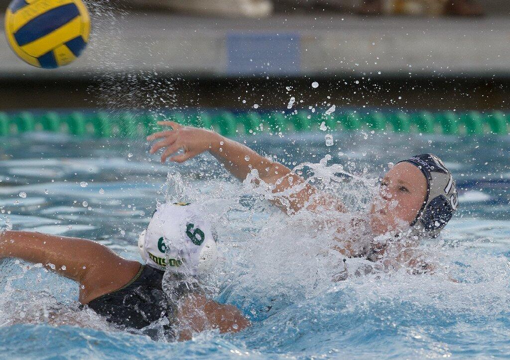Newport Harbor High's Lissa Westerman, right, scores against Edison's Chloe Kunst (6) during the first half in a Sunset League game on Wednesday.