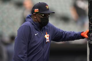 Houston Astros manager Dusty Baker Jr., watches warmups before Game 3 of a baseball American League Division Series.
