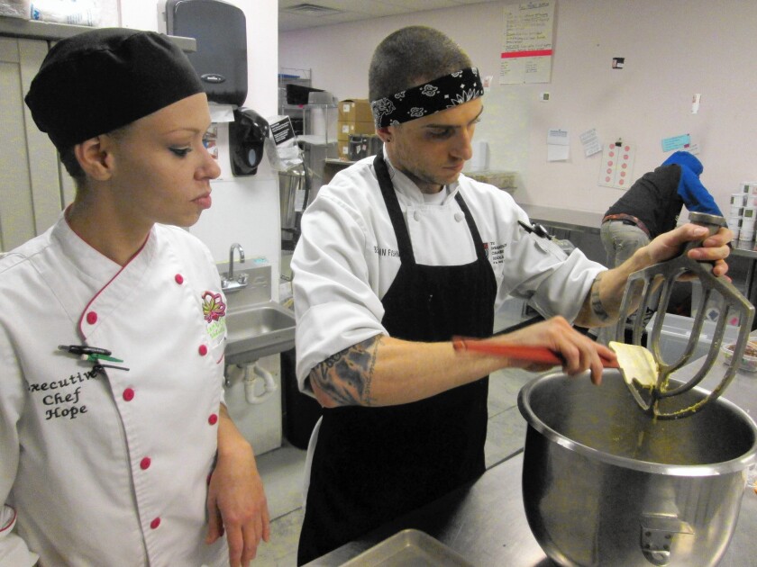 Executive Chef Hope Frahm watches Benjamin Fishman make a base for a cannabis-infused baklava at Love's Oven in Denver.