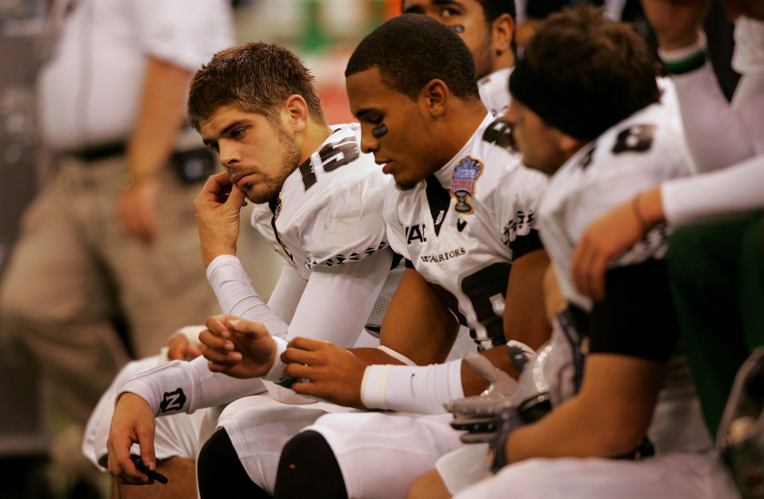 Colt Brennan sits on the bench with his teammates during a loss to Georgia at the 2008 Sugar Bowl in New Orleans.