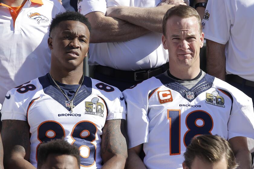 Denver Broncos wide receiver Demaryius Thomas (88) and quarterback Peyton Manning (18) pose for team photos before an NFL football walk through practice in Santa Clara, Calif., Saturday, Feb. 6, 2016. (AP Photo/Jeff Chiu)