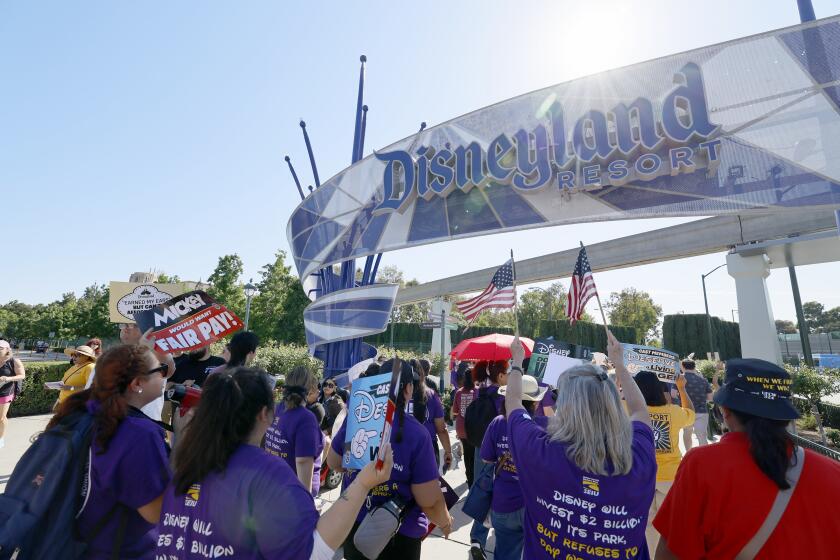 Anaheim, CA - July 17: Over 400 Disney cast members rally outside the Disneyland Main Entrance Ahead of ULP Strike Authorization Vote Disneyland in Anaheim Wednesday, July 17, 2024. The Bakery, Confectionery, Tobacco Workers and Grain Millers (BCTGM) Local 83, SEIU-United Service Workers West (SEIU-USWW), Teamsters Local 495 and the United Food and Commercial Workers (UFCW) Local 324, together representing 14,000 cast members at Disneyland, Disney California Adventure, Downtown Disney and the Disney hotels, rally outside the main entrance to Disneyland Resort two days prior to holding a vote to authorize an Unfair Labor Practice strike. Strikers say the strike authorization vote follows unfair labor practices alleging hundreds of labor violations by Disney throughout negotiations that have interfered with the Unions getting the fair contract cast members deserve. (Allen J. Schaben / Los Angeles Times)