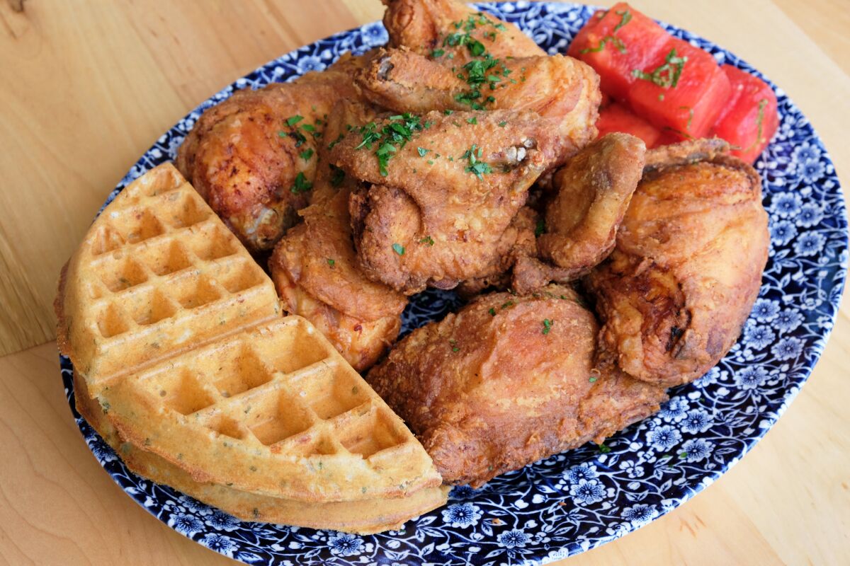 A plate of fried chicken and cheddar waffles from Yardbird Southern Table and Bar at the Beverly Center.