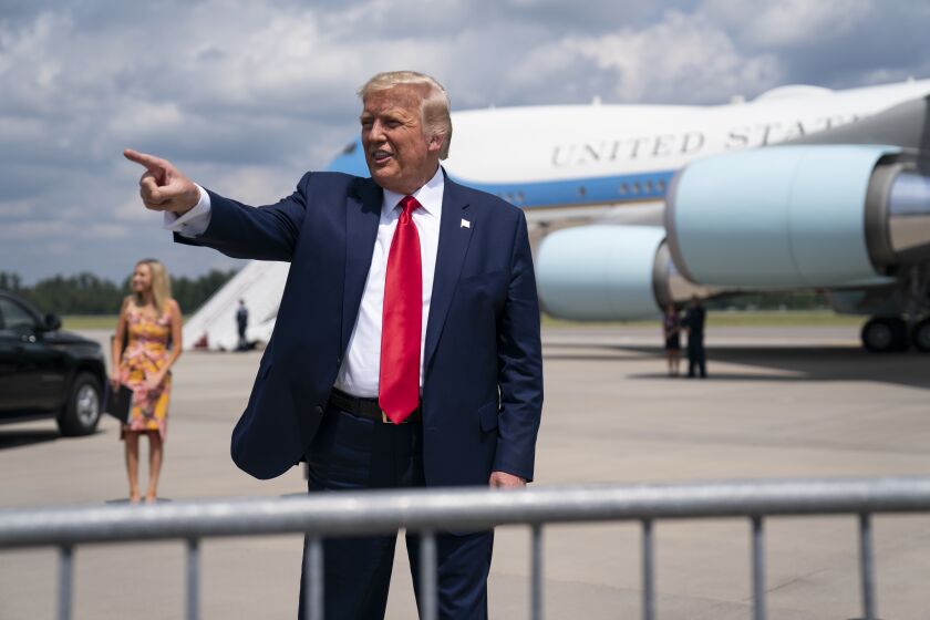 President Donald Trump talks to a crowd of supporters after arriving at Wilmington International Airport, Wednesday, Sept. 2, 2020, in Wilmington, N.C. (AP Photo/Evan Vucci)