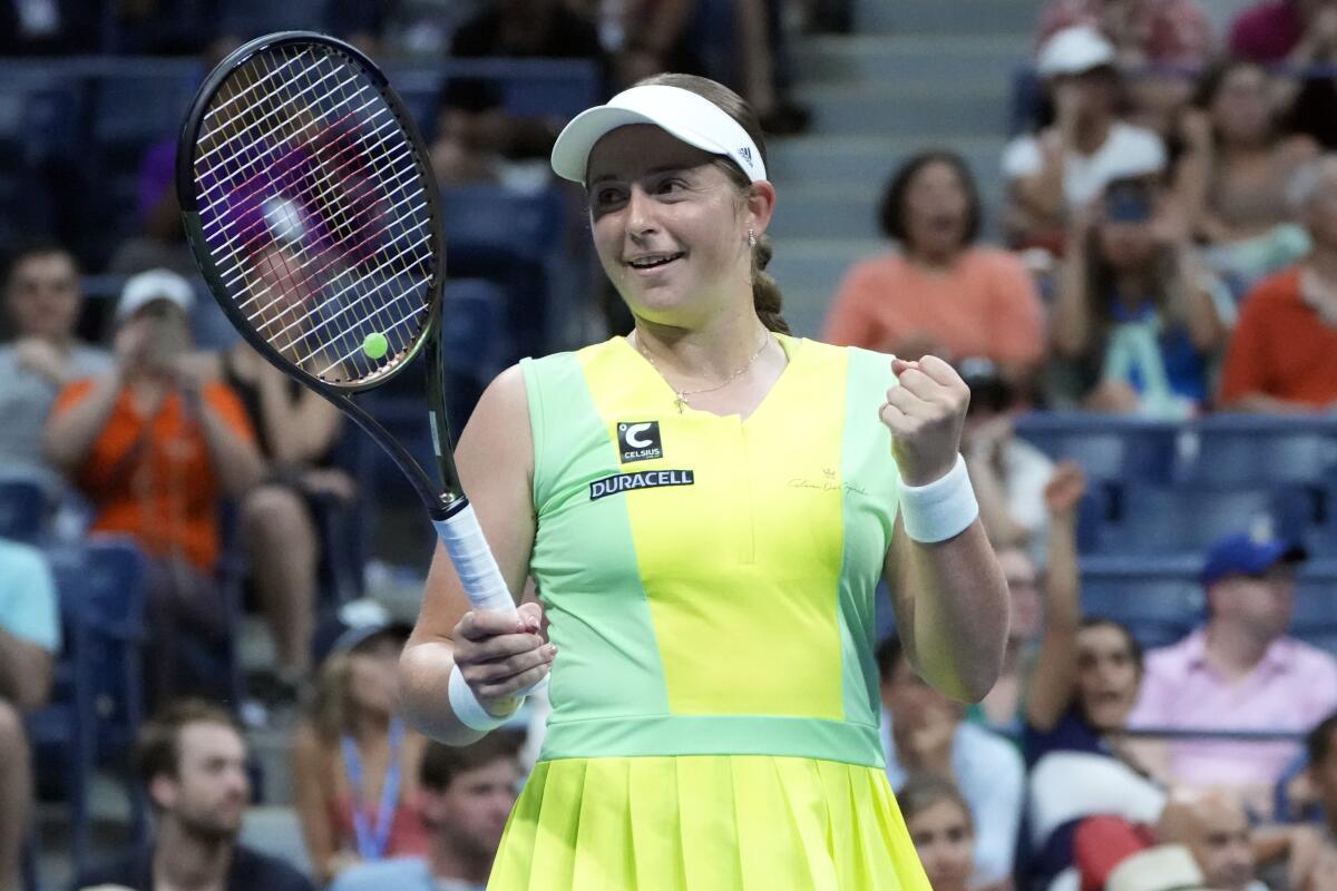 Jelena Ostapenko, of Latvia, celebrates after defeating Iga Swiatek, of Poland.