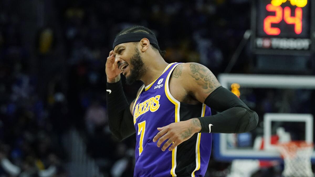 Lakers forward Carmelo Anthony reacts after a play.