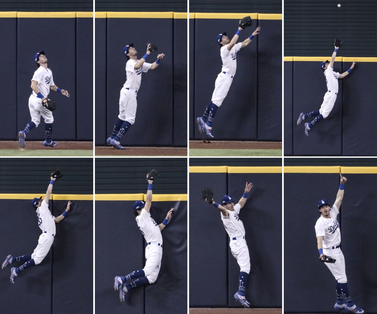 A sequence of images shows Cody Bellinger leaping up and slightly over a wall to catch a ball.