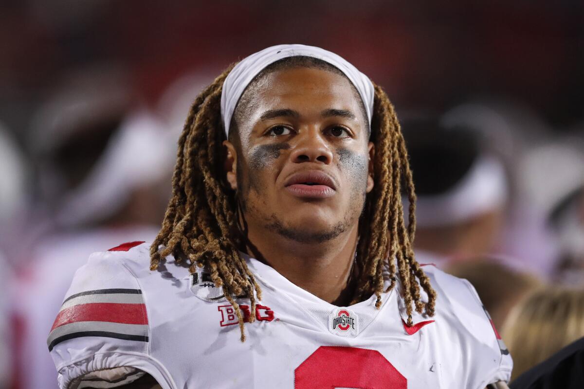 Ohio State defensive end Chase Young looks at the scoreboard during the second half of an NCAA college football game against Northwestern.