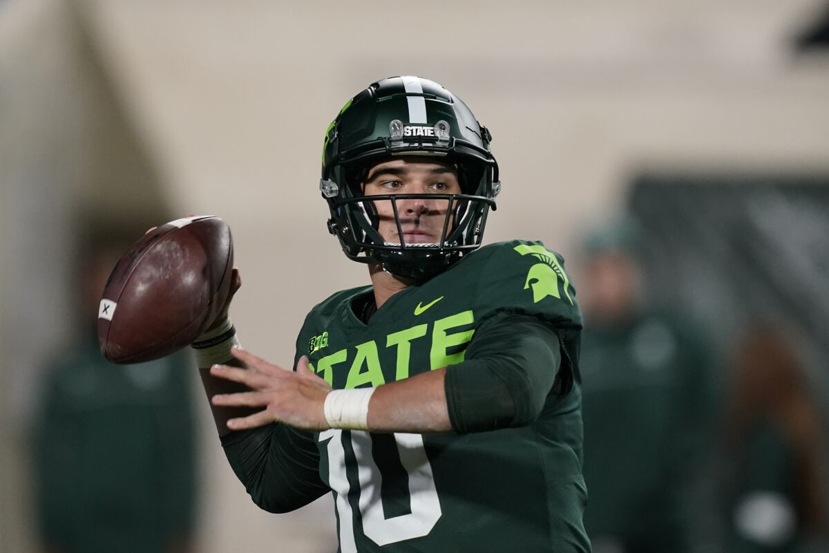 Michigan State quarterback Payton Thorne throws during the second half of an NCAA college football game against Maryland, Saturday, Nov. 13, 2021, in East Lansing, Mich. (AP Photo/Carlos Osorio)