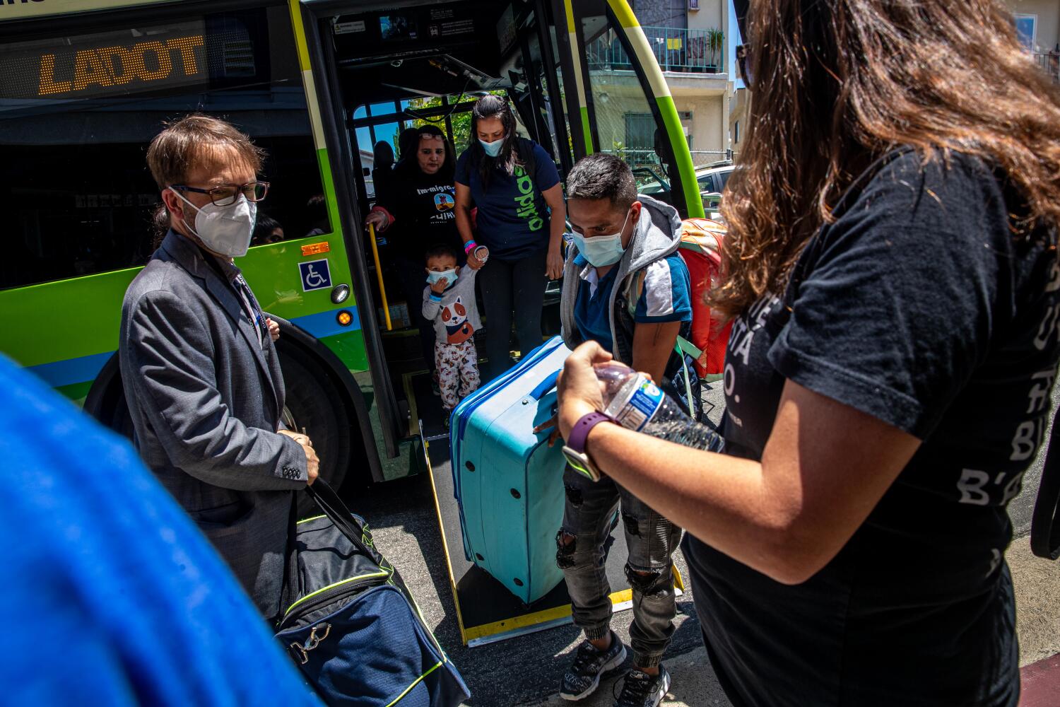 Three more buses carrying dozens of asylum seekers arrive in L.A. from Texas