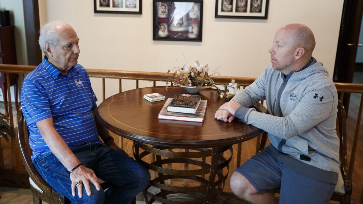 Hep Cronin, left, speaks with his son, UCLA basketball coach Mick Cronin, at Mick's home in Cincinnati.