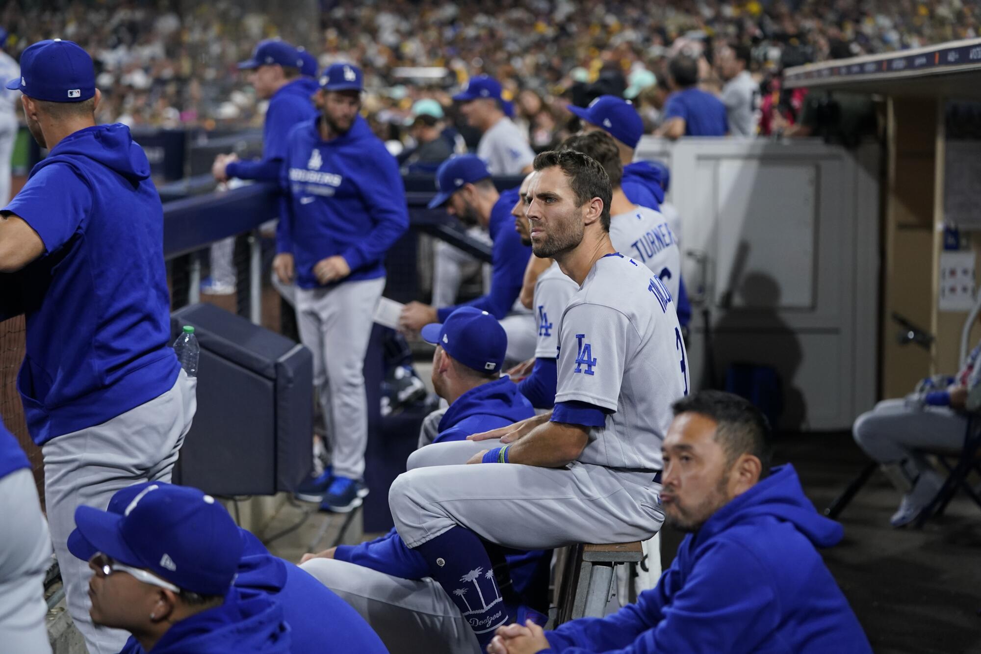 Dodgers left fielder Chris Taylor watches from the dugout during Game 3 of the NLDS against the San Diego Padres.