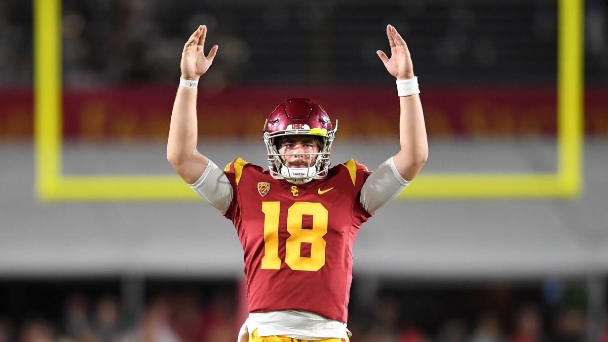 USC quarterback J.T. Daniels signals touchdown on a catch by Michael Pittman Jr.