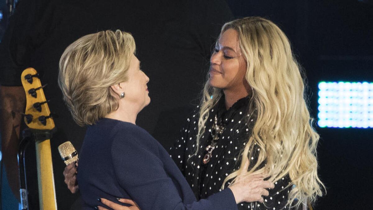 Hillary Clinton and Beyoncé embrace during a campaign rally in Cleveland on Nov. 4.