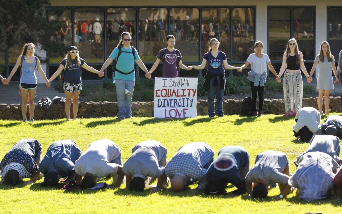 Muslim students prayed at UC San Diego as other students surrounded them in support on Monday, Jan. 30, 2017. Students at the school were protesting recent actions by President Donald Trump. (Photo by K.C. Alfred/The San Diego Union-Tribune)