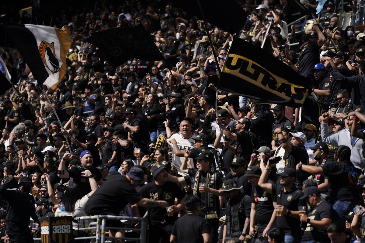 Los Angeles FC fans cheer before the team's match against the Colorado Rapids on Feb. 26