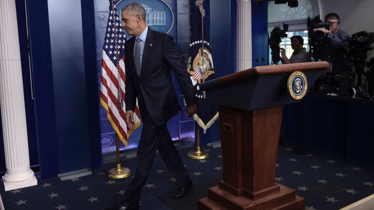 President Obama leaves his final presidential news conference Wednesday at the White House briefing room.