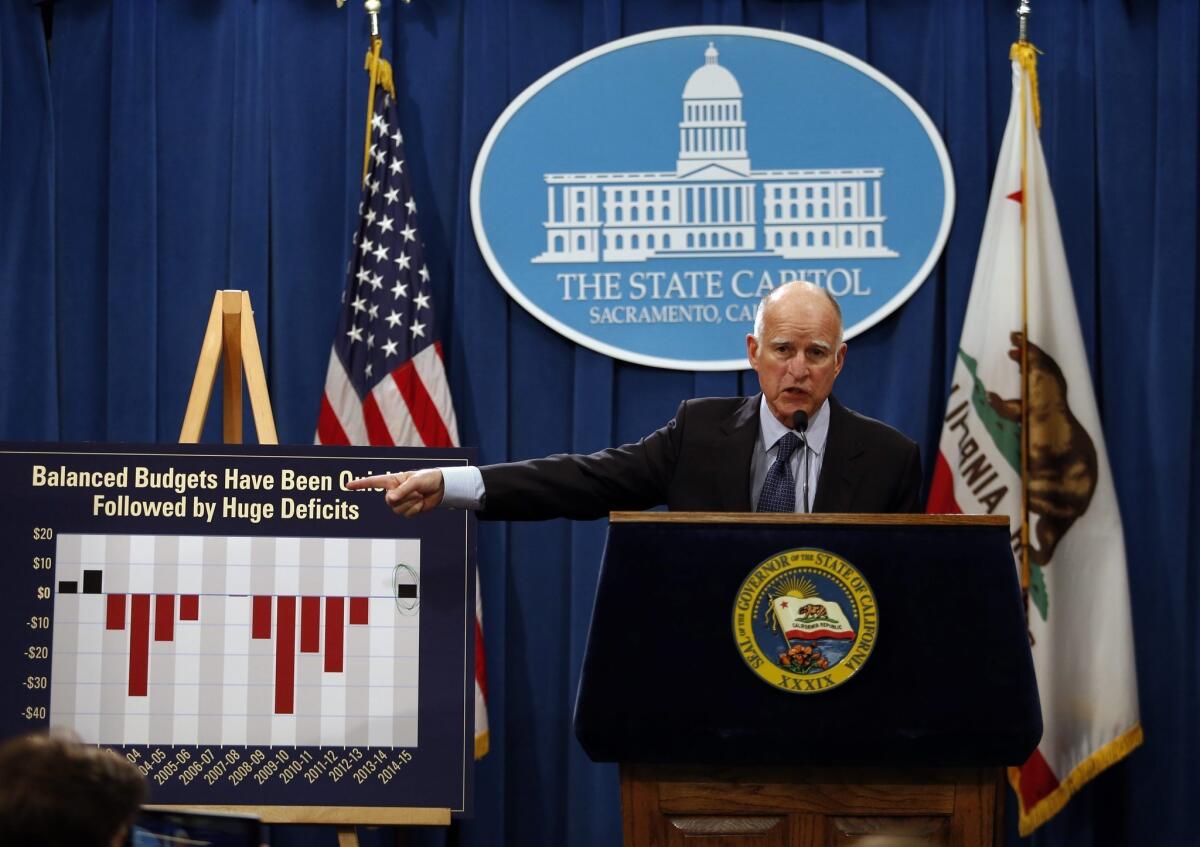 Gov. Jerry Brown addresses the media during a press conference where he introduced his new 2014-15 budget in Sacramento.