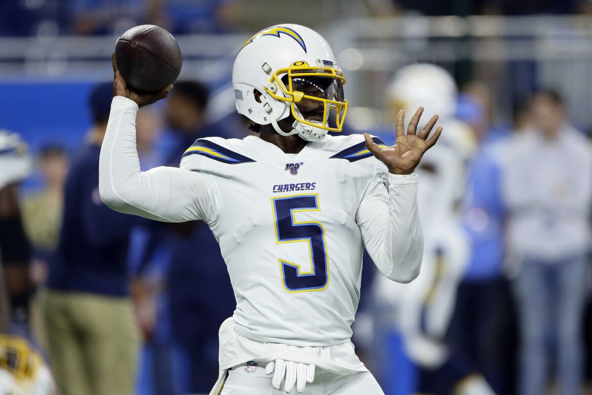 FILE - In this Sept. 15, 2019, file photo, Los Angeles Chargers quarterback Tyrod Taylor throws before an NFL football game against the Detroit Lions in Detroit. Coach Anthony Lynn is trying his best to quiet any doubts that Taylor will be the Chargers quarterback to start the season. (AP Photo/Duane Burleson, File)
