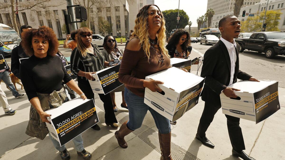 LaTisha Nixon, the mother of Gemmel Moore, who died of a methamphetamine overdose in the home of Democratic donor Ed Buck in 2017, leads members of Color of Change to deliver petitions to L.A. County Dist. Atty. Jackie Lacey.