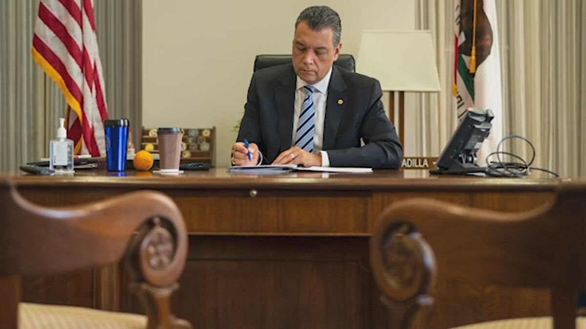 Alex Padilla at his Senate office desk