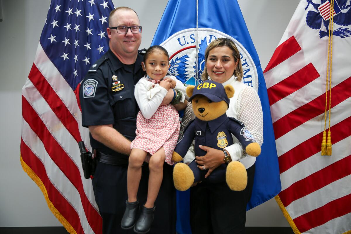 Justin Lott, Alexa and her mother, Myrna Sanchez, holding custom-made teddy bear Lott gave Alexa.