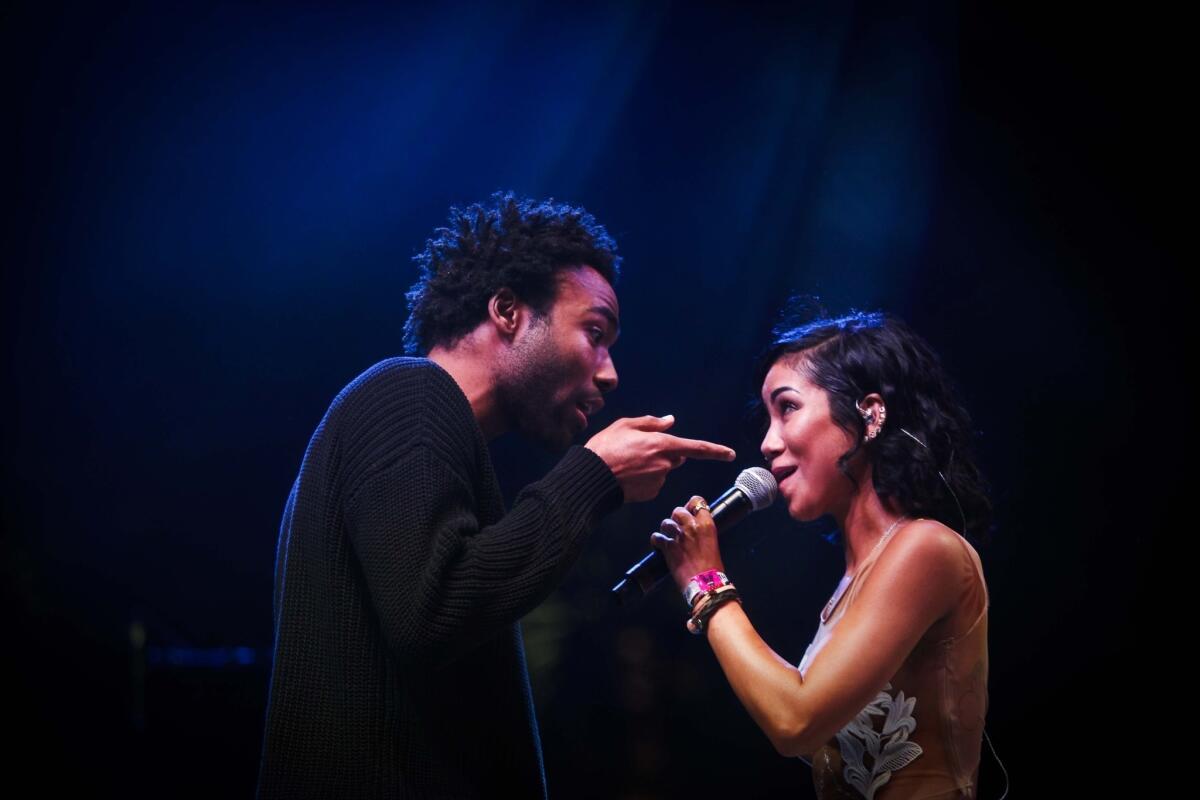Childish Gambino guest performs with Jhene Aiko on the Gobi stage at the Coachella Valley Music and Arts Festival in Indio on Sunday, the last day of the first weekend of the festival.