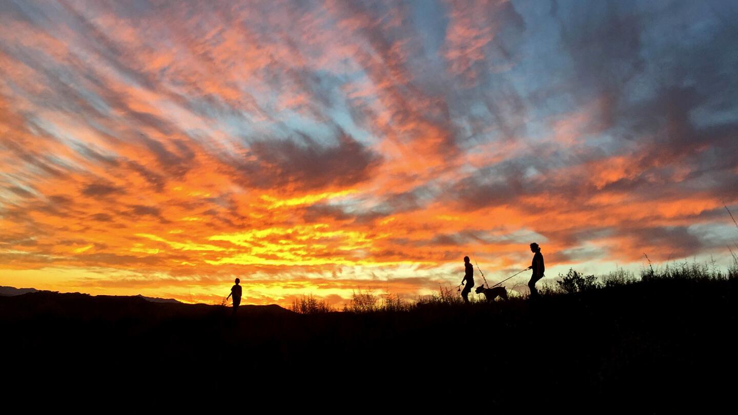 Hikers cross a ridgeline in the Upper Las Virgenes Canyon Open Space Preserve.