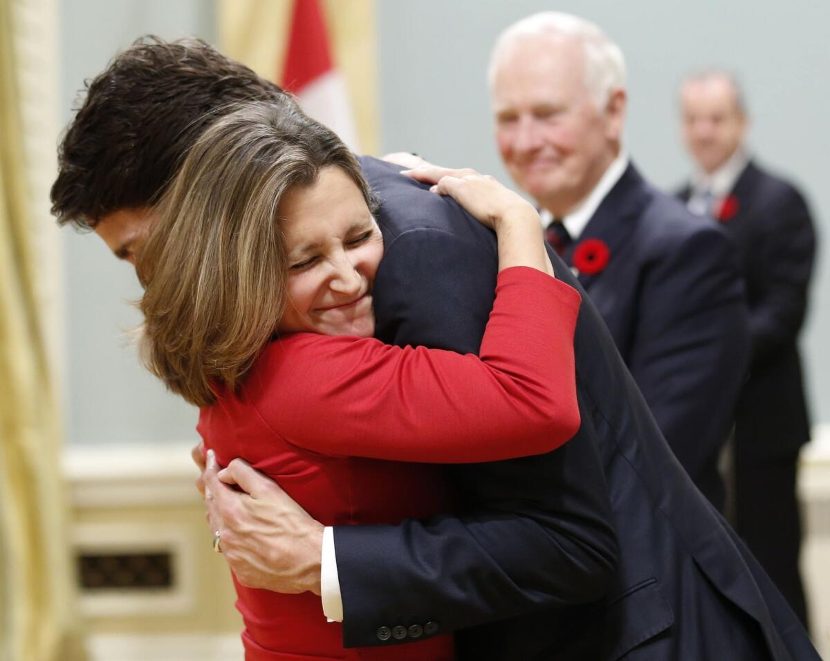 Canada's new International Trade Minister, Chrystia Freeland, left, is congratulated by Prime Minister Justin Trudeau after the Liberal Party victory on Nov. 4.