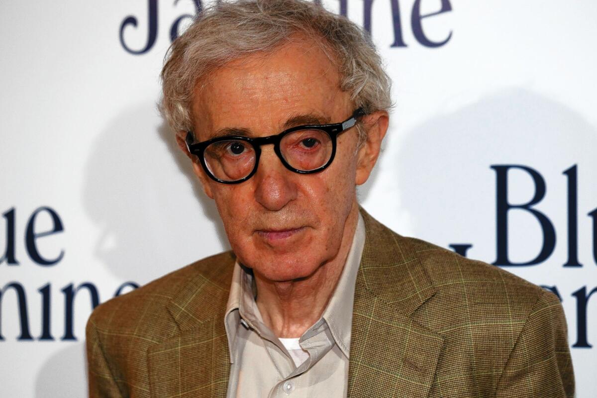Woody Allen appears at a screening of his latest movie. His adopted daughter Dylan Farrow has written an open letter offering details about sexual abuse she says she suffered when she was 7.