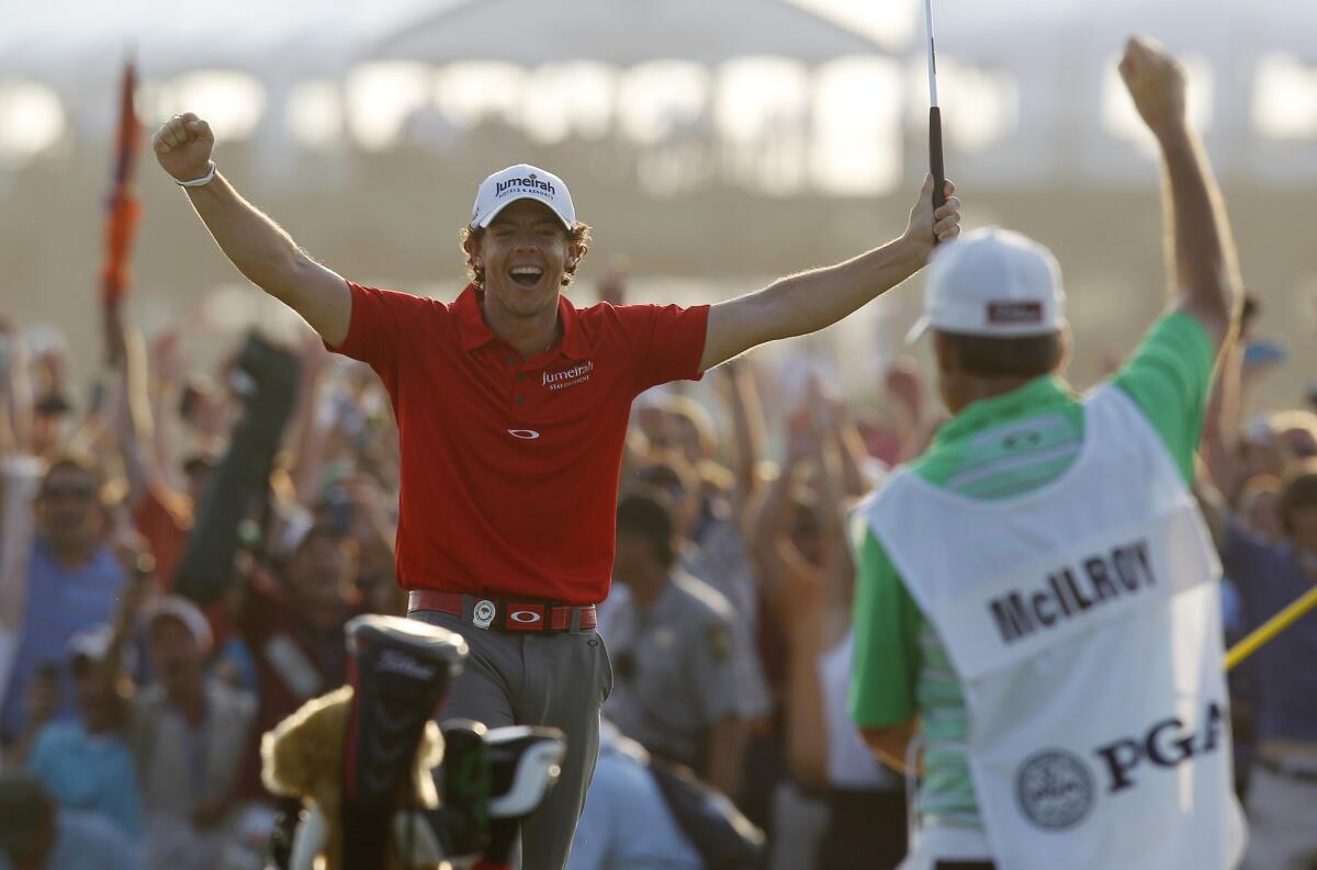 Rory McIlroy reacts after a birdie at No. 18 clinched a record PGA triumph in 2012.