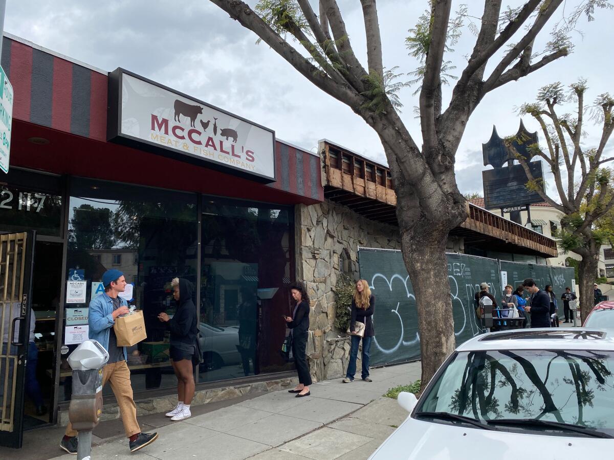 A line of customers forms outside McCall's Meat and Fish Co. in Los Feliz on Friday