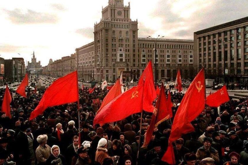 Crowds of pro–communist demonstrators, holding Soviet–era flags, gather 23 February at the start of a march in Moscow. The march marks the Day of the Defender of the Fatherland, the former Soviet Army Day.