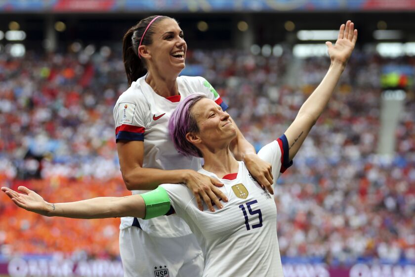FILE - United States' Megan Rapinoe, right, celebrates after scoring the opening goal.