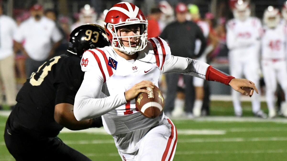 Quarterback JT Daniels and top-ranked Mater Dei scrambled to a 31-21 victory over No. 2 St. John Bosco in a Trinity League showdown on Friday.