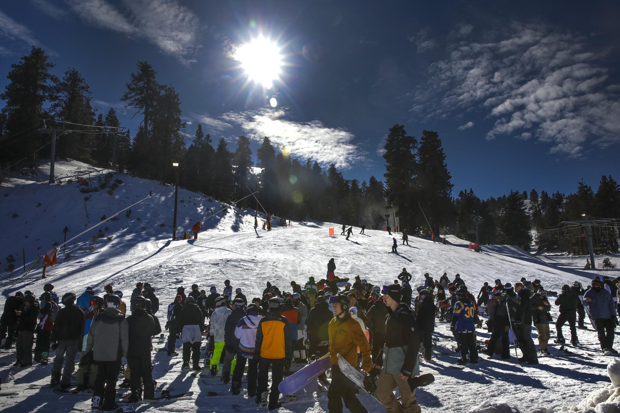 Skiers and snow boarders enjoy freshly fallen snow at Mountain High in Wrightwood on Wednesday.
