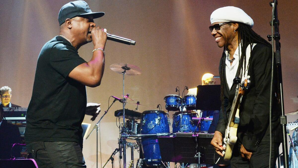 Recording artist Chuck D, left, and 2015 BMI Icon Award honoree Nile Rodgers perform onstage at the 2015 BMI R&B/Hip-Hop Awards.