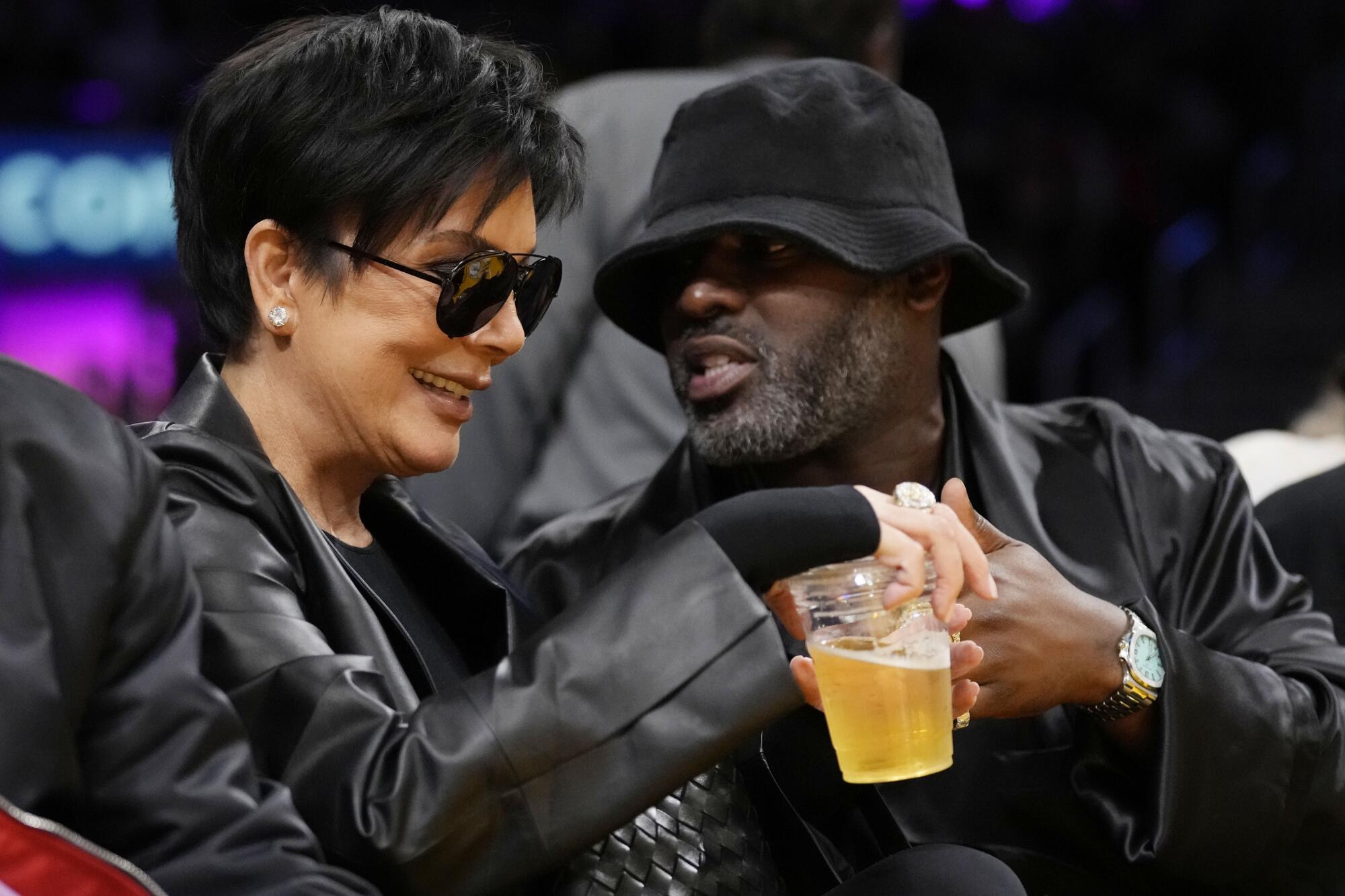Kris Jenner sits next to boyfriend Corey Gamble in the second half of Game 4 of the NBA basketball Western Conference Final.