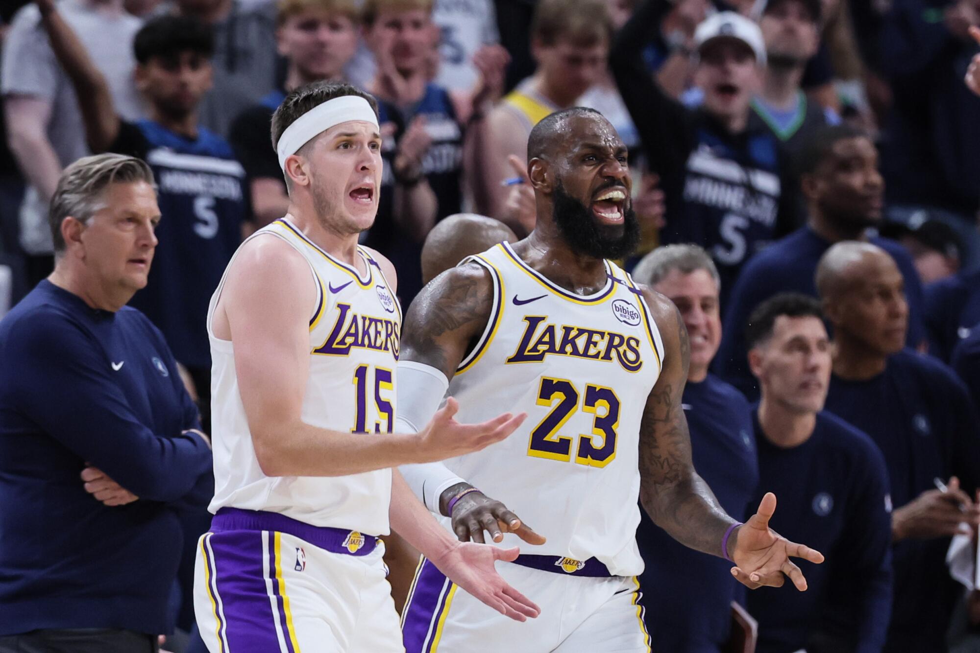 Lakers forward LeBron James and teammate Austin Reaves react to a referee's call during a 2025 NBA playoff game.